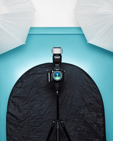 Camera on a tripod and other photographic materials. Concept of photographic studio.の写真素材