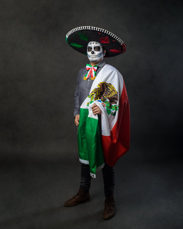 Portrait of catrin wearing charro hat and showing mexican flag. Day of the dead.の写真素材