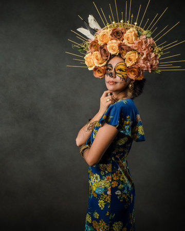 Portrait of a woman with sugar skull makeup. Day of the dead and halloween character with dark background.の写真素材