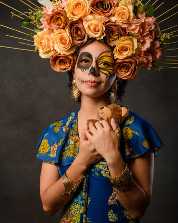 Portrait of a woman with sugar skull makeup. Day of the dead and halloween character with dark background.の写真素材