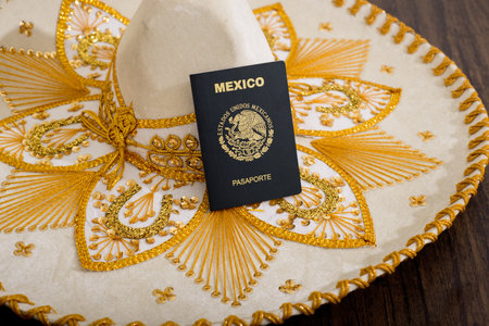 Mexican passport on charro hat. Mariachi hat and Mexican passport. Mexican citizenship concept.の写真素材