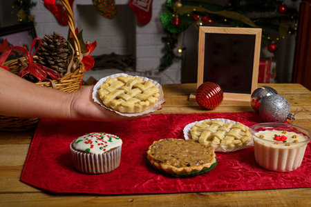 Sweet canapes and pastries on a table with a Christmas background.の写真素材