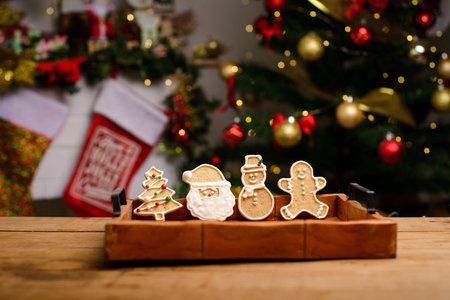 Gingerbread cookies with different figures on a wooden table. Christmas background. Christmas dessert.の写真素材