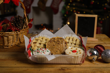 Sweet canapes and pastries on a table with a Christmas background.の写真素材
