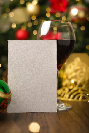Gift card or Christmas greeting card or commemorative moment on a table with Christmas decorations. Christmas card mockup.の写真素材
