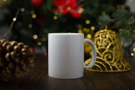 Mockup of coffee cup on table with christmas decoration. Coffee mug with christmas background.の写真素材