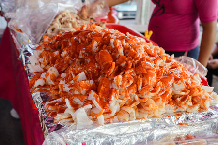 Stall selling cueritos with hot sauce. Typical mexican snack.