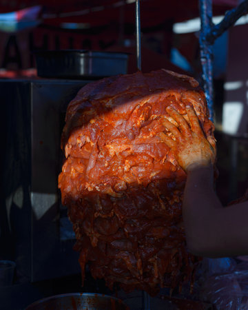 Meat trompo for tacos al pastor. Mexican street food. Marinated meat al pastor.の写真素材