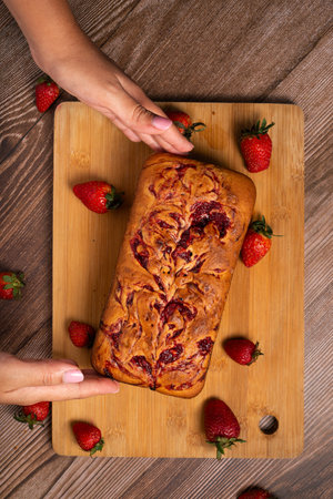 Pound cake with homemade strawberry jam. Pound cake and strawberries on a wooden table.の写真素材