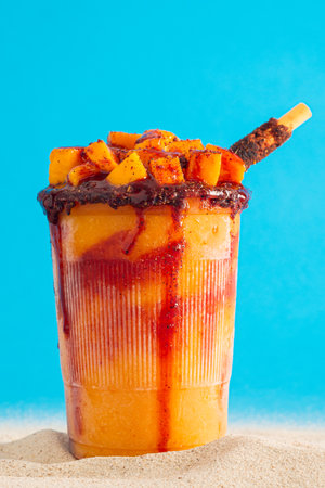 Mangonada, typical Mexican mango smoothie with chamoy sauce and lime juice.
