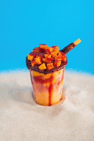Mangonada, typical mexican mango smoothie with chamoy sauce and lime juice.