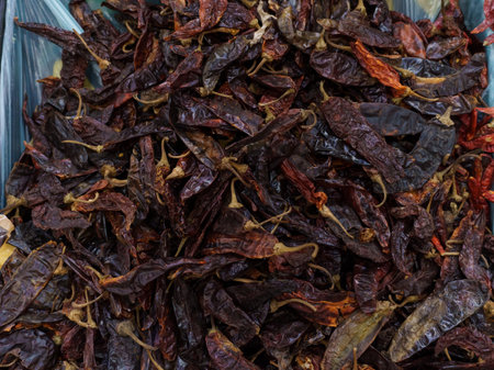 Guajillo chili on supermarket shelves.Variety of chili peppers on supermarket shelves in Mexico.