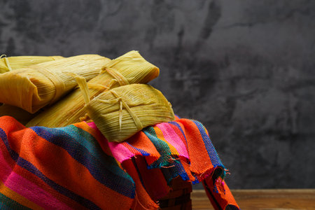 Tamales on a colorful tablecloth. Mexican food. Copy space.の写真素材