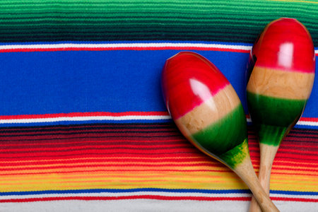 Maracas on colorful serape. Cinco de mayo background.の写真素材