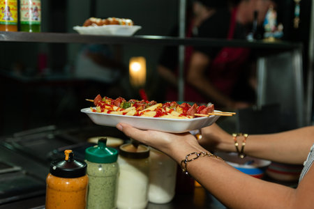 Delicious Street Food Skewers and Fries Served in Styrofoam Tray.の写真素材