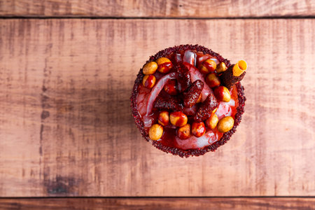 Little glass, a mixture of sweet, salty and spicy ingredients. Typical snack from Mexico.