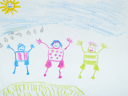 A vibrant child's crayon drawing depicts three joyfully expressive figures playing beneath a cheerful sun and a light blue skyの写真素材