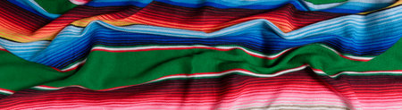 Colorful serape. Typical colorful fabric from Mexico. Texture background. Banner