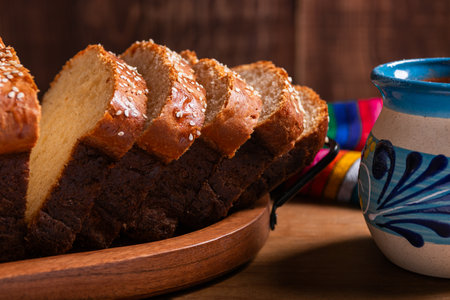 Salvadoran yolk bread, accompanied by a cup of hot chocolate.の写真素材