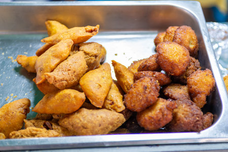 Salvadoran plantain empanadas at a street food stall.