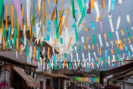 Vibrant Colorful Ribbon Street Decoration Celebration in a Charming Mexican Townの写真素材