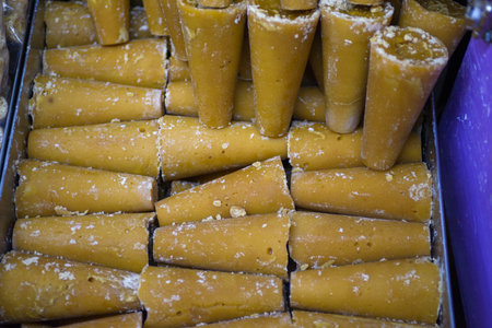 Piloncillo, a traditional unrefined cane sugar, in a cone shape.の写真素材