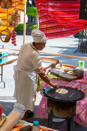 Cuernavaca, Morelos. Mexico. November 7, 2025. X World Forum on Mexican Gastronomy. Mexican Woman Selling Traditional Food at Local Marketのeditorial素材