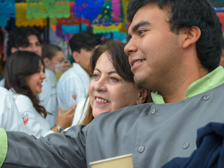 Cuernavaca, Morelos. Mexico. November 7, 2025. X World Forum on Mexican Gastronomy. Young man takes a selfie with the governor of Cuernavaca.のeditorial素材