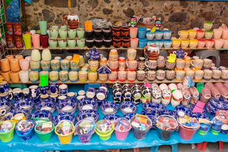 Vibrant Colorful Pottery Display with Unique Handmade Mexican Ceramic Handicraftの写真素材