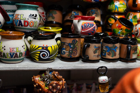 Colorful Handcrafted Pottery Mugs Featuring El Salvador Decoration at Local Marketの写真素材