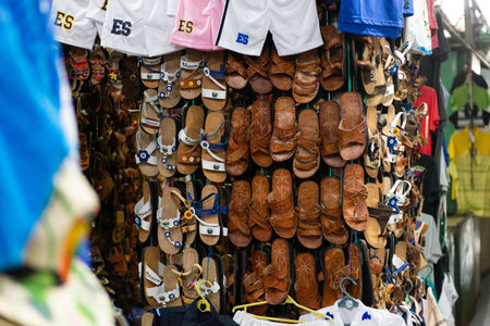 Vibrant Display of Handcrafted Sandals and Apparel at Local Market
