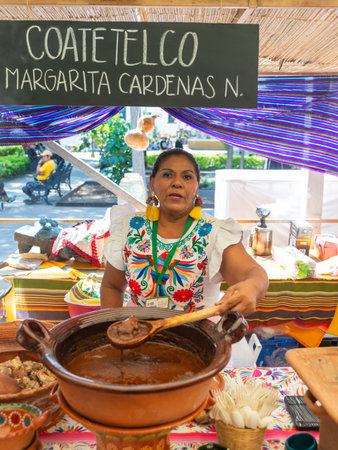 Cuernavaca, Morelos. Mexico. November 7, 2025. X World Forum on Mexican Gastronomy. Mexican Woman Selling Traditional Food at Local Marketのeditorial素材