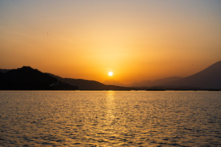 Golden Hour Serenity, Lake Reflection at Sunset Landscape. Olomega lagoon.の写真素材
