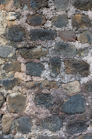 Rustic Stone Wall Texture with Mortar Joints and Natural Color Variationの写真素材