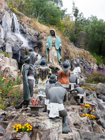 Statues of Our Lady of Guadalupe appearing to St. Juan Diego and indigenous peopleの写真素材