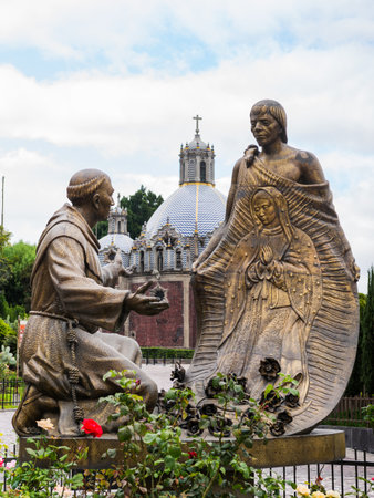 Statue depicting Saint Juan Diego presenting his tilma with the image of the Virgin of Guadalupe to Fray Juan de Zumarraga.の写真素材