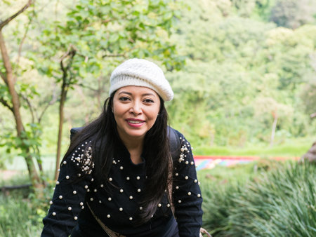 A beautiful woman smiling in a natural setting.の写真素材