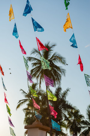 Vivid Paper Cut Banners Suspended Against a Clear Blue Sky Scene. Shredded paper