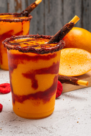 Mangonada, typical Mexican mango smoothie with chamoy sauce and lime juice.