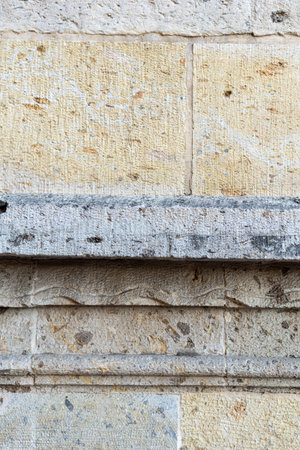 Weathered Limestone Block Wall Architecture Detail with Horizontal Carved Molding