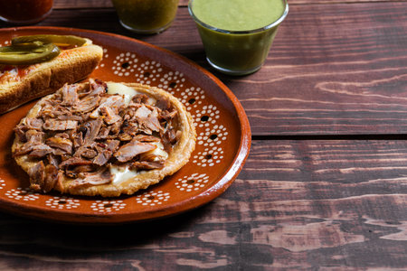 Close-up Delicious Mexican sopes with meat as the main ingredient
