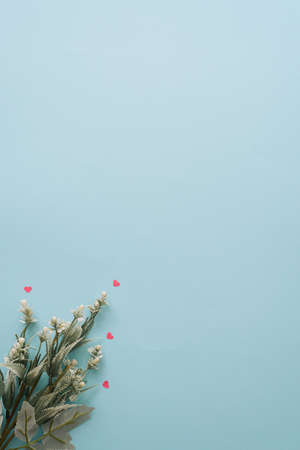 Top view of green flowers and leaves. Creative copyspace. Minimal valentines or womans day conceptの写真素材