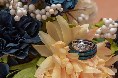 Blue and Silver Wedding Rings with Bouquetの写真素材