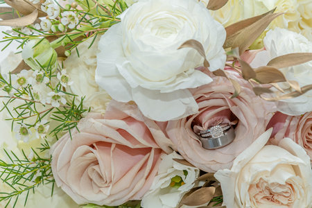 The Bride and Grooms Wedding Rings in the Bouquetの写真素材
