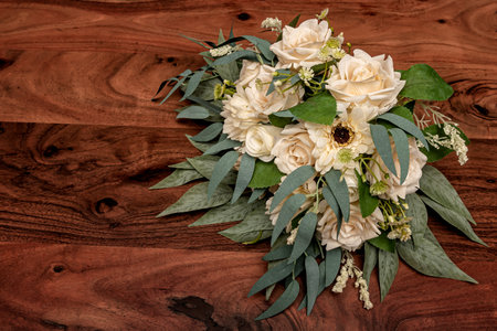 The ivory bridal wedding bouquet for the big day on a rustic wood background.の写真素材