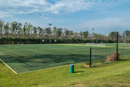 An empty and vacant soccer field at a park with all sports fields closed during the coronavirus...
