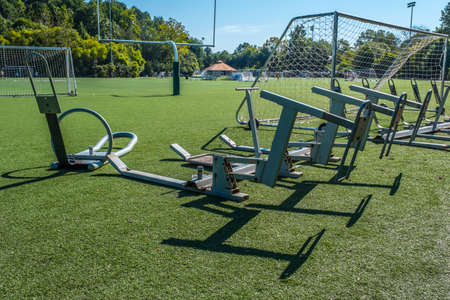 A football training sled sitting on artificial grass unused at a football and soccer field in a sports park on a bright sunny day in late summerの写真素材