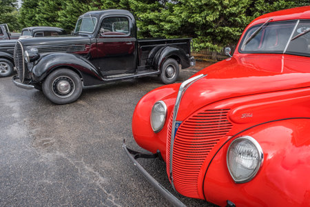 Clarkesville, Georgia USA - September 12, 2020  Partial view of a old bight red restored Ford car...