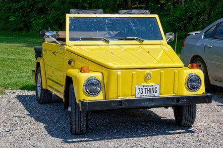 Jamestown, Tennessee USA - July 22, 2023  Bright yellow convertible 1973 Volkswagen car called the...