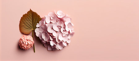Creative layout made of hydrangea flowers on pastel pink background. Flat lay, top view minimal...